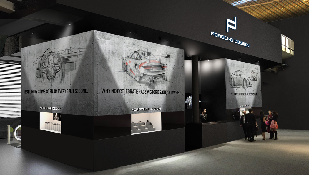 Gesamtkonzept des Porsche Design Messestands auf der Baselworld, mit Betonoptik und Motorsport-Skizzen, gestaltet von MORE PIOUS STUDIOS.